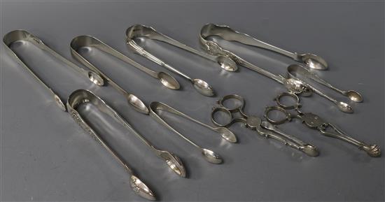 Six pairs of Georgian and late silver sugar tongs, a plated pair of tongs and two pairs of Georgian silver sugar nips, 9 oz